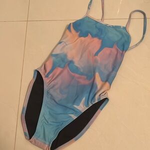 mix of blue pink and purple jolyn tie back suit, adjustable straps